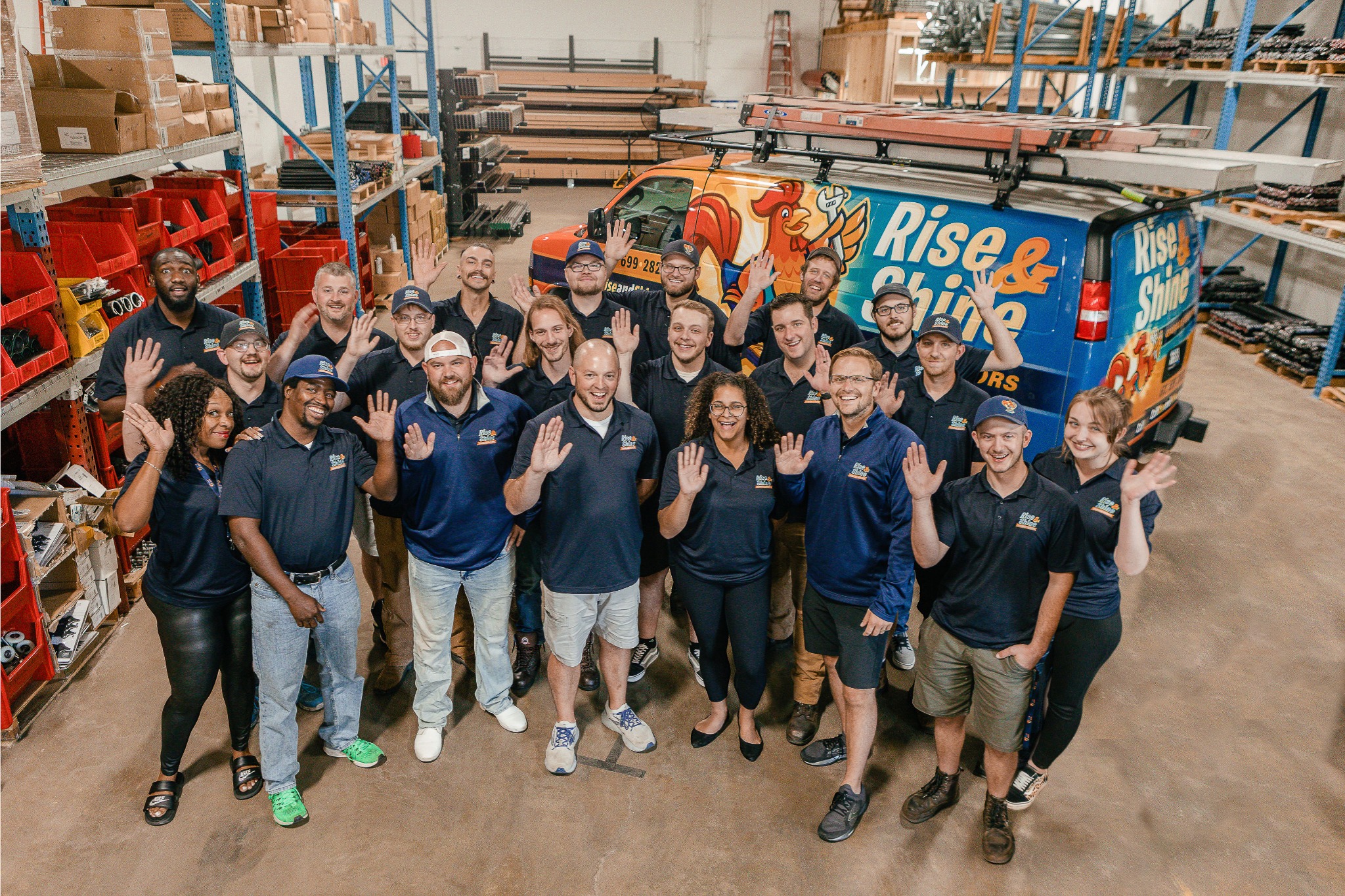 Brown garage door on blue siding house.
