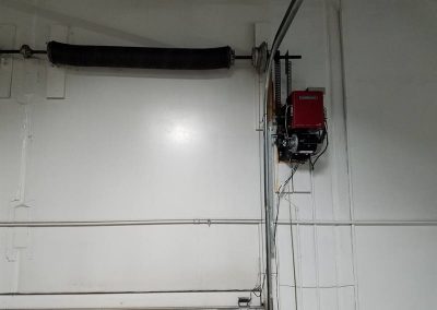 Commercial garage door opener with torsion spring.