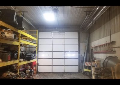 Industrial garage with white sectional door.