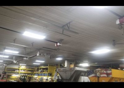 Industrial garage with ceiling-mounted door openers.