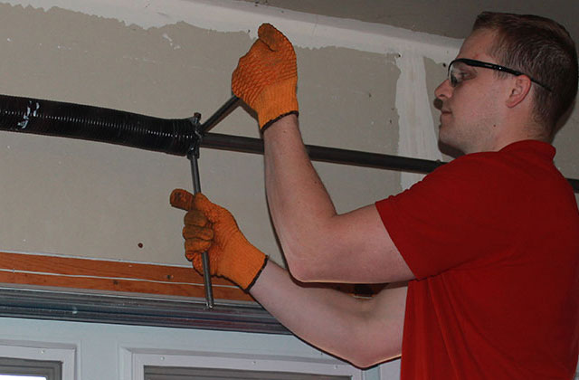 Garage Door Spring Repair In Progress
