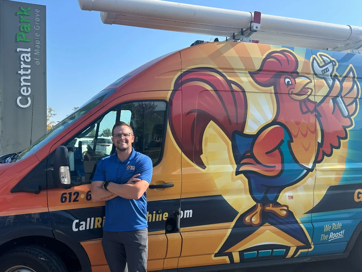 Maple_Grove_Garage_Door_Company Alex, owner of Rise & Shine Garage Doors, standing in front of his van in Central Park of Maple Grove, MN.